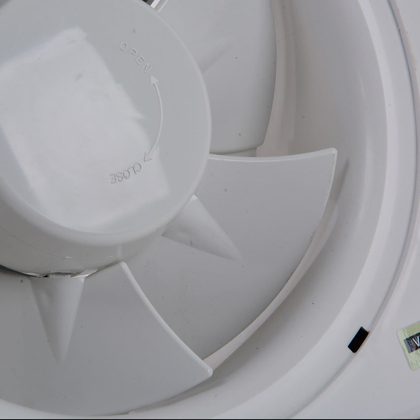 Close-up of a white plastic component with text on it